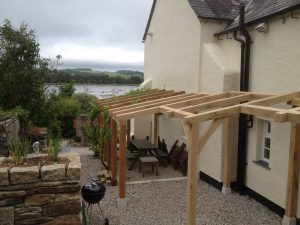 Green Oak timber framed jointed and pegged barbecue shelter overlooking the Tamar River at Weir Quay Devon