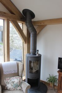 traditionally timber framed cabin in devon single storey with wood stove