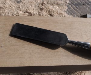1 1/2in hand timber framing framers chisel tools on seasoned oak planed board