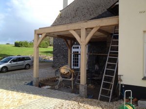 green oak tamar timber frame covered veranda attached to house as entrance porch in cornwall