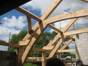 green oak timber frame being built on the devon cornwall border